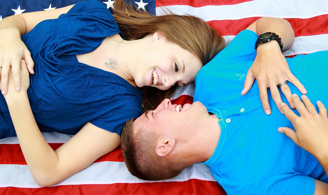 Military couple and flag - Veteran Home Buyers FORUM