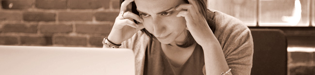 Woman studying credit on a computer screen, Credit Repair, Understanding Credit