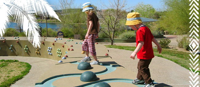 Children walking on decorative stone wall = Gilbert Arizona, Best Cities, Best Places to Live - Bill Salvatore, Arizona Elite Properties 602-999-0952 - Arizona Real Estate