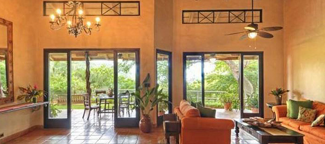 stucco walls and shining tile floor, wall of windows overlooking lush greenery - Mel Gibson's Costa Rica house for sale, Costa Rica Vacation property, Luxury home on Costa Rica - Bill Salvatore, Arizona Elite Properties 602-999-0952 - Costa Rica Real Estate for Sale