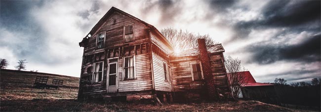 old delapitated home and mottled, dark sky - Selling a haunted house - Is my house haunted - Photo by bryan-minear on Unsplash - Bill Salvatore, Arizona Elite Properties 602-999-0952 - Arizona Real Estate